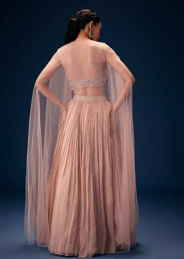 Peach Ruched Lehenga With Embroidered Blouse and Net Cape