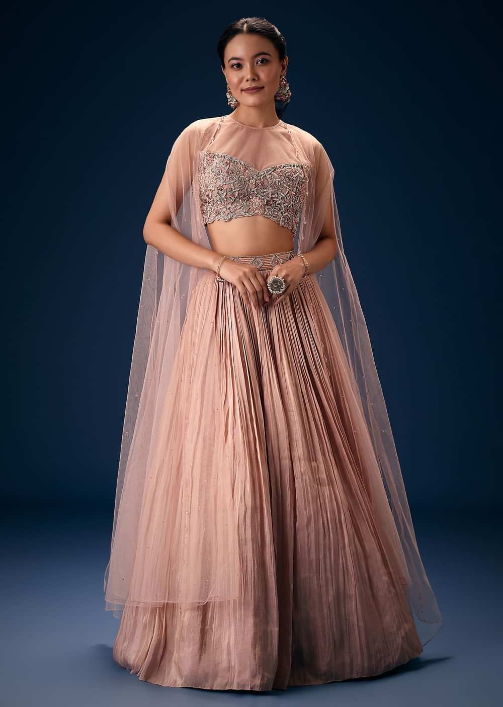 Peach Ruched Lehenga With Embroidered Blouse and Net Cape