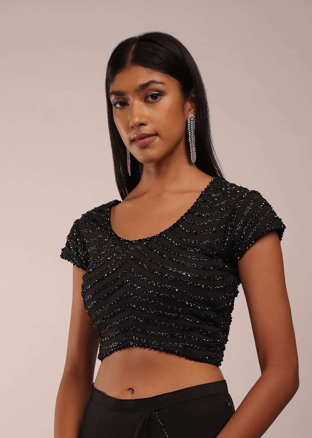 Pitch Black Saree With Three Tones Of Layered Frills On The Bottom Embellished In Stones And Sequins With A Tassel On The Pallu Corner