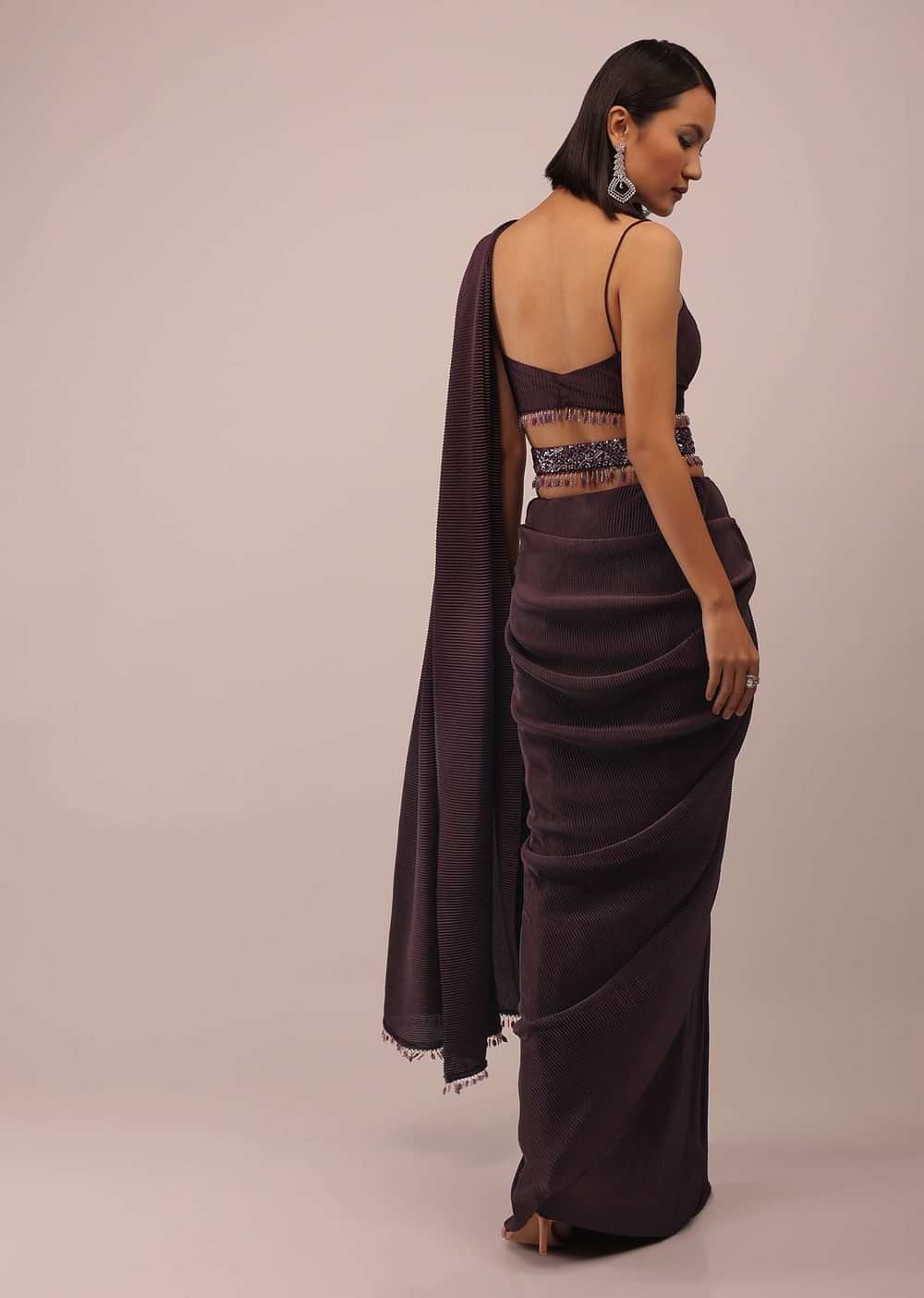 Plum Saree With Moti And Cut Dana Fringes Detailing On The Pallu And A Spaghetti Straps Crop Top With An Embroidered Belt In Fringes