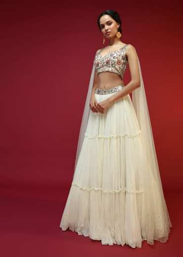 Powder White Lehenga Choli With Attached Cape And Hand Embroidery Using Colorful Resham And Sequins In Floral Motifs
