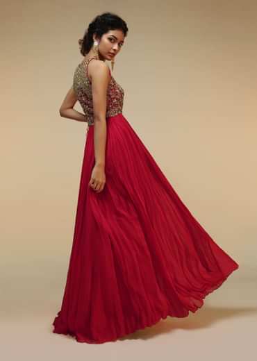 Rani Pink Anarkali Suit With Halter Neckline And Adorned In Multicolored Hand Embroidered Floral Design On The Bodice