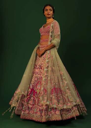 Rani Pink Lehenga Choli In Raw Silk With Heavy Embroidered Kalis Using Colorful Resham And Cut Dana In Floral Motifs Online - Kalki Fashion