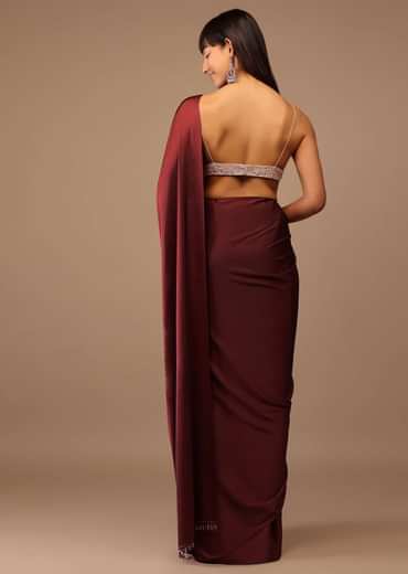 Blood Red Satin Saree With Fringes On The Pallu Paired With Hand Embroidered Bustier