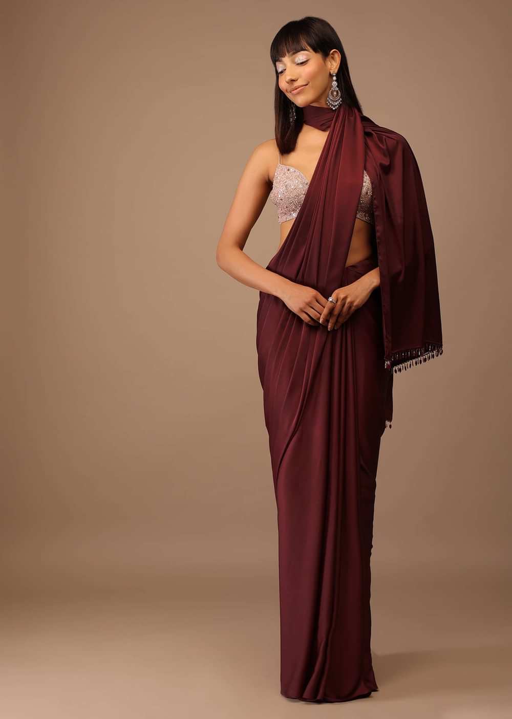 Blood Red Satin Saree With Fringes On The Pallu Paired With Hand Embroidered Bustier