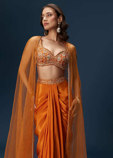 Rust Dhoti Skirt Set With Embellished Blouse And Tassel Net Dupatta