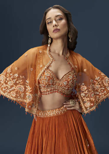 Rust Orange Embroidered Lehenga With Dramatic Cape And Blouse