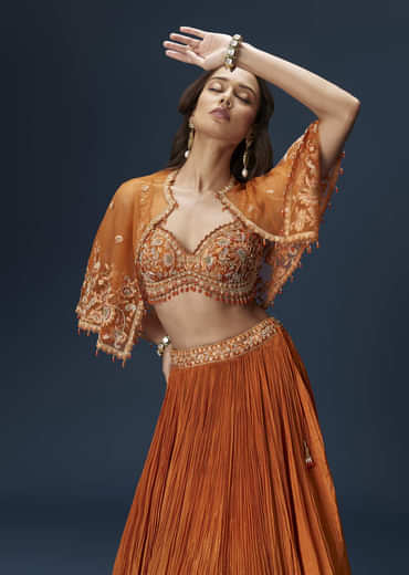 Rust Orange Embroidered Lehenga With Dramatic Cape And Blouse