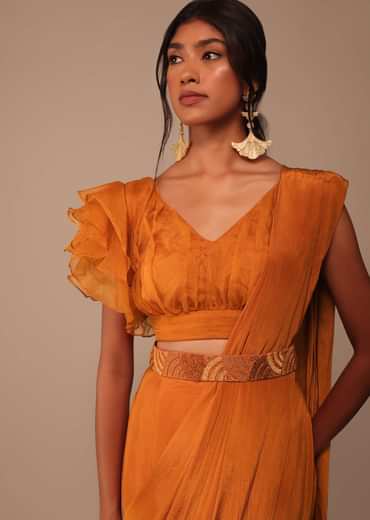 Rust Orange Saree With Fancy Ruffle Blouse And Embroidered Belt