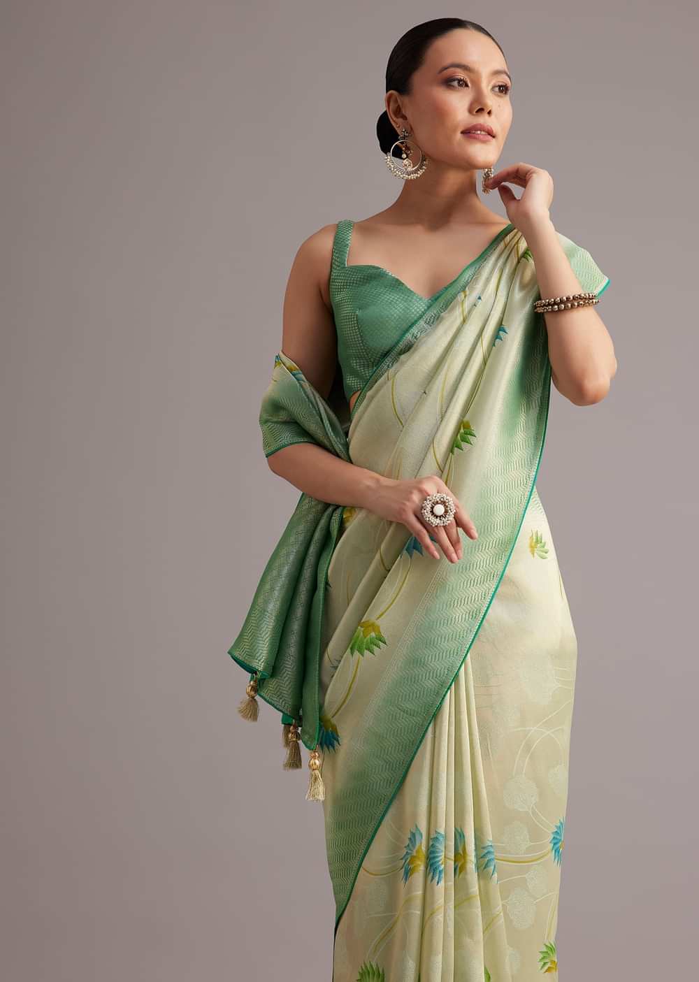 Sea Green Tissue Silk Floral Motif Saree With Contrast Pallu And Border