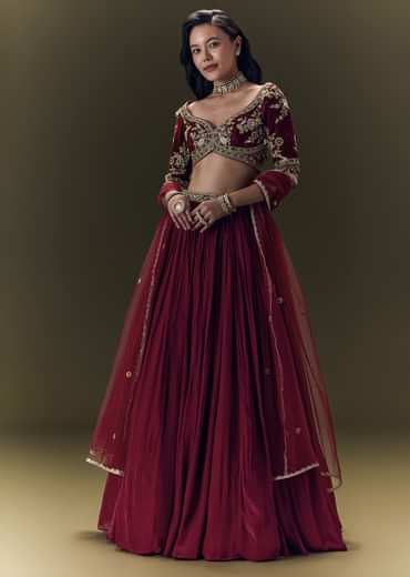 Maroon Pleated Skirt With Hand Embroidered Velvet Belt And Blouse With Net Dupatta