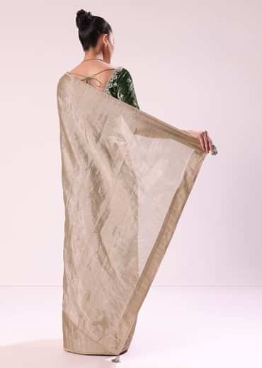 Silver Zari Tissue Saree With Embroidered Emerald Green Stitched Blouse