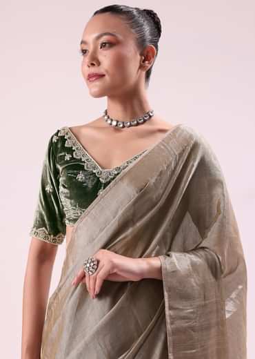 Silver Zari Tissue Saree With Embroidered Emerald Green Stitched Blouse