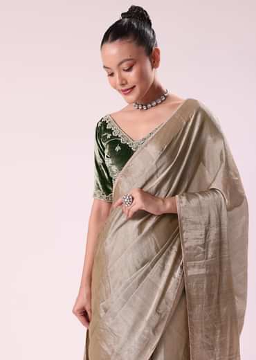 Silver Zari Tissue Saree With Embroidered Emerald Green Stitched Blouse