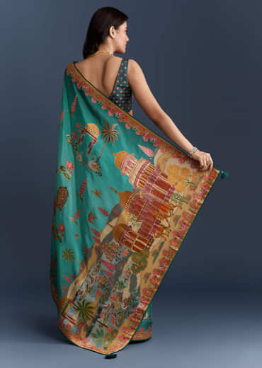 Teal Blue Dola Silk Saree With Nature Motifs And Embroidery