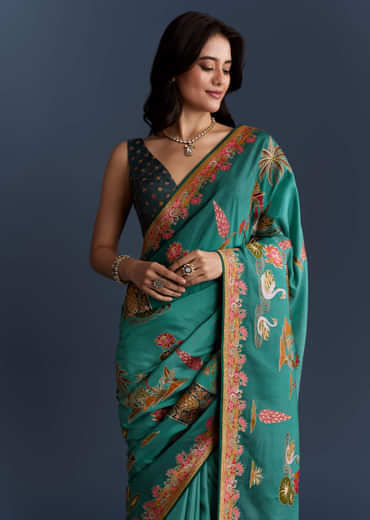 Teal Blue Dola Silk Saree With Nature Motifs And Embroidery