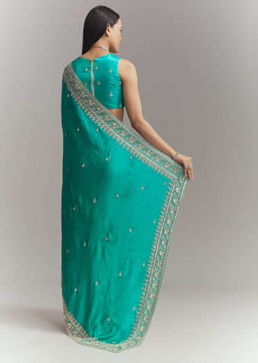 Turquoise Blue Satin Embroidered Saree With Heavy Hand Embroidery