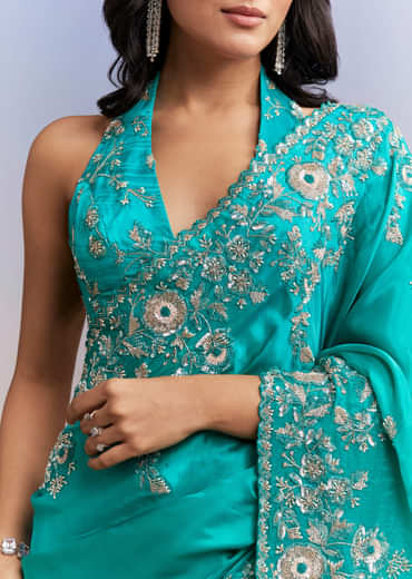Turquoise Blue Satin Saree With Heavy Embroidered Details