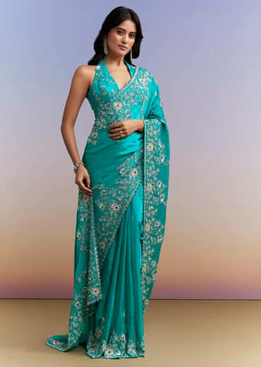 Turquoise Blue Satin Saree With Heavy Embroidered Details