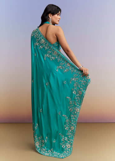 Turquoise Blue Satin Saree With Heavy Embroidered Details