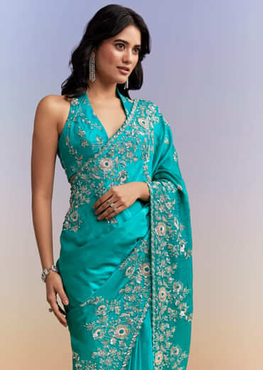Turquoise Blue Satin Saree With Heavy Embroidered Details