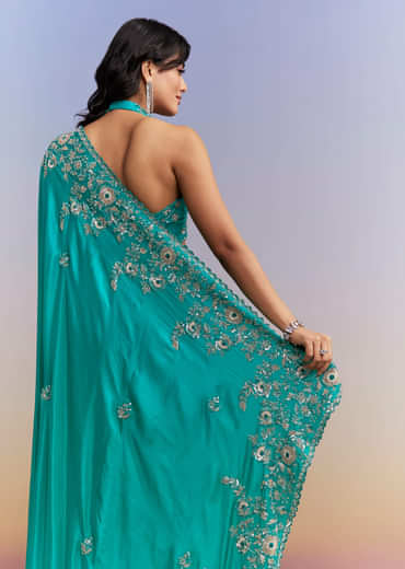 Turquoise Blue Satin Saree With Heavy Embroidered Details