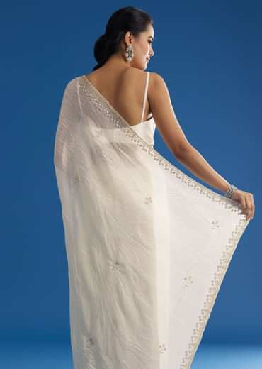 White Crushed Tissue Saree With Stones And Sequins Embroidery And Scallop Border