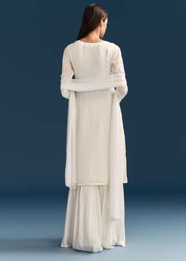 White Pakistani Sharara Suit With Sequin Details And Dupatta