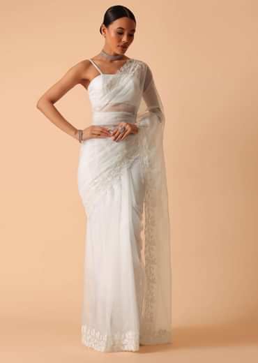 White Saree In Organza With Floral Motif Border And Unstitched Blouse Piece