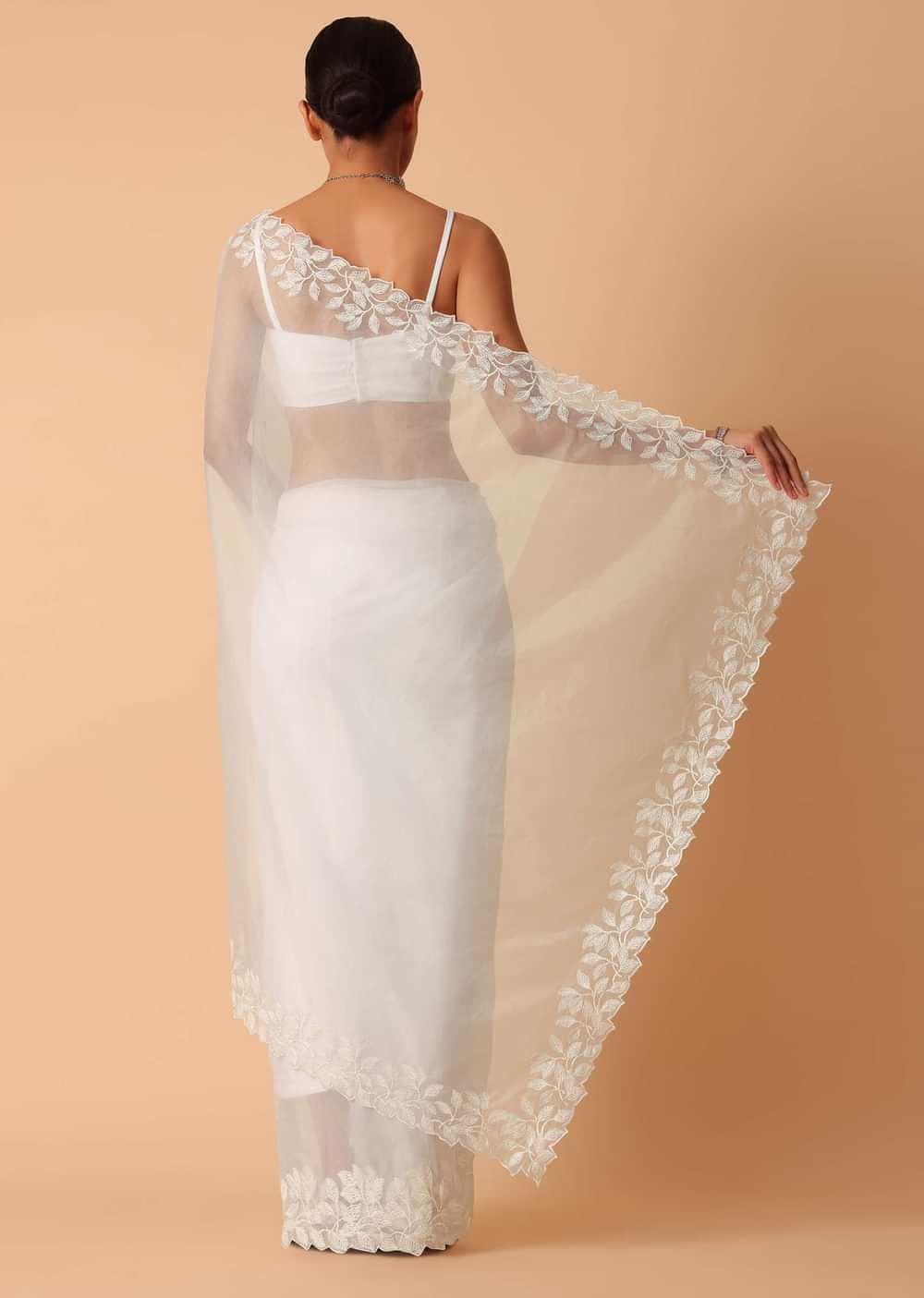 White Saree In Organza With Floral Motif Border And Unstitched Blouse Piece