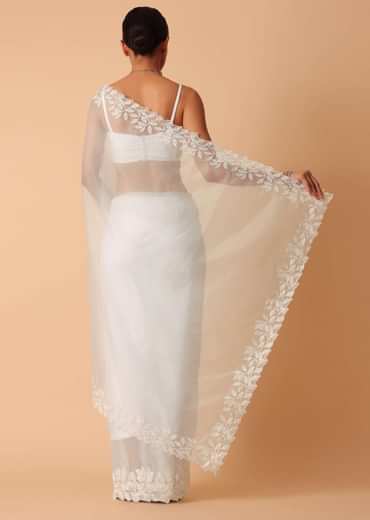 White Saree In Organza With Floral Motif Border And Unstitched Blouse Piece