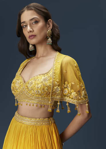 Yellow Bridesmaid Lehenga With Sleeveless Blouse And Draped Cape