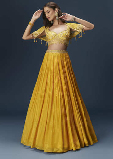 Yellow Bridesmaid Lehenga With Sleeveless Blouse And Draped Cape